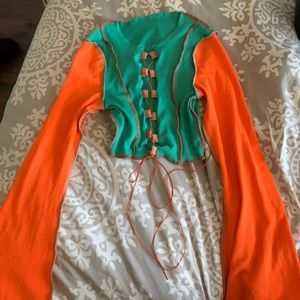 teal and orange lace up top